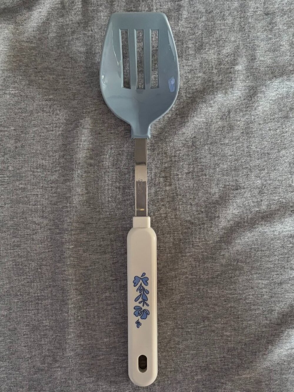 Robinson Nylon Blue and White Slotted Spoon with Blue Flowers on the Handle.